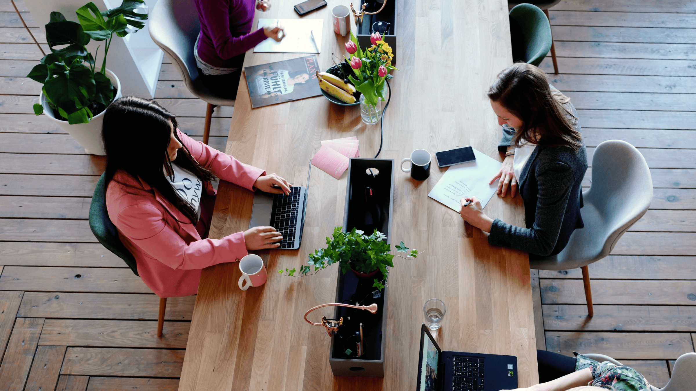 A high performance executive team working efficiently at a desk.