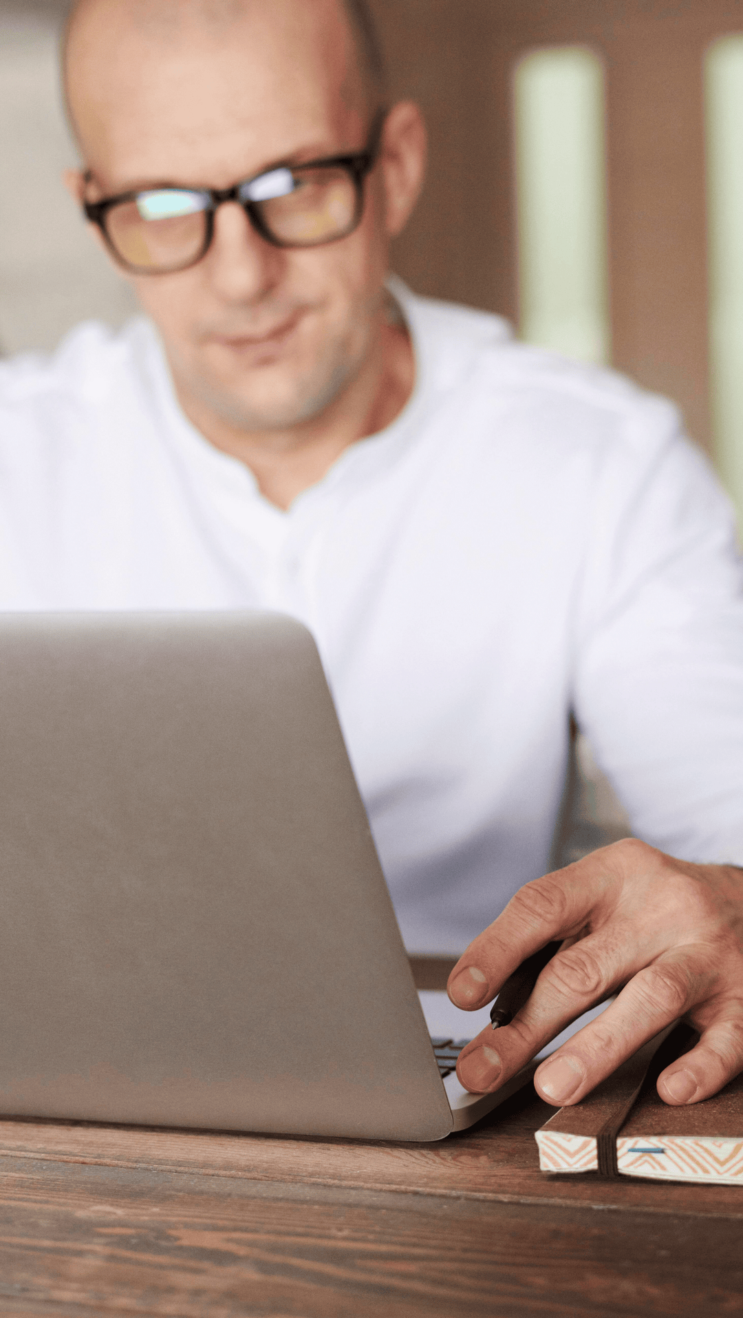 An Executive Leader working at his laptop.