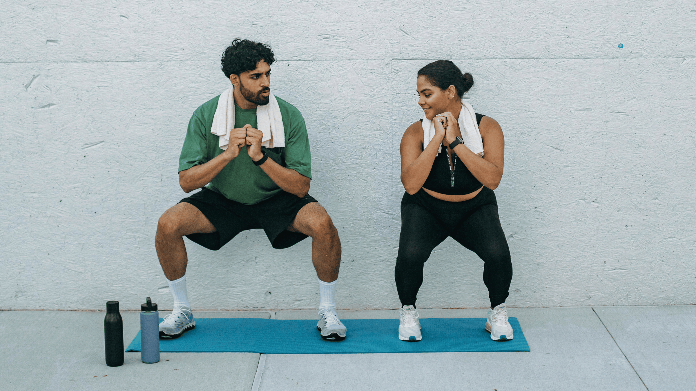 A man and woman athlete exercising. 